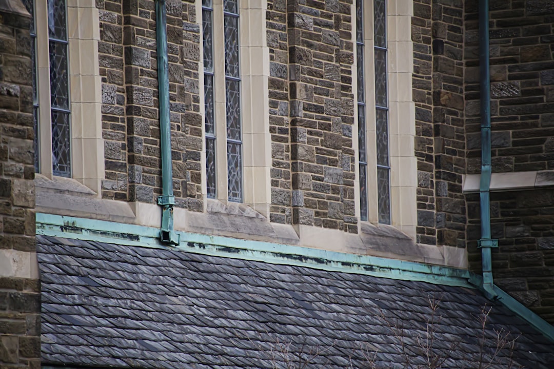 Copper half-round gutters with patina on a historic Jackson, TN home